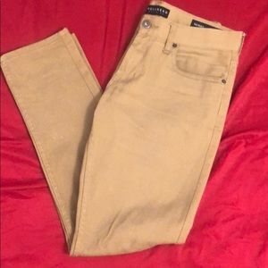 Khaki colored skinny jeans.